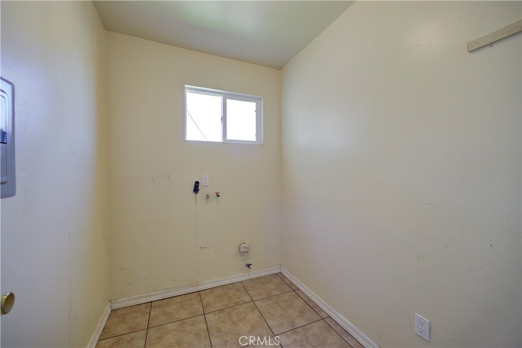 4579 11th Street Guadalupe, CA 93434 - Photo 22 of 40 a view of a small space with wooden floor and a window