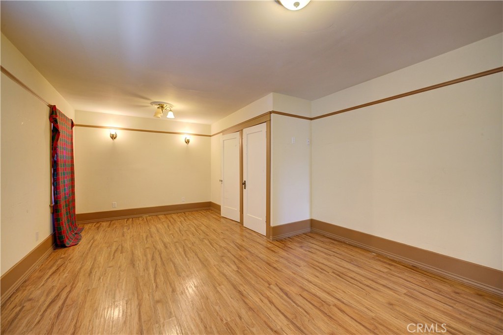 4579 11th Street Guadalupe, CA 93434 - Photo 25 of 40 a view of an empty room with wooden floor