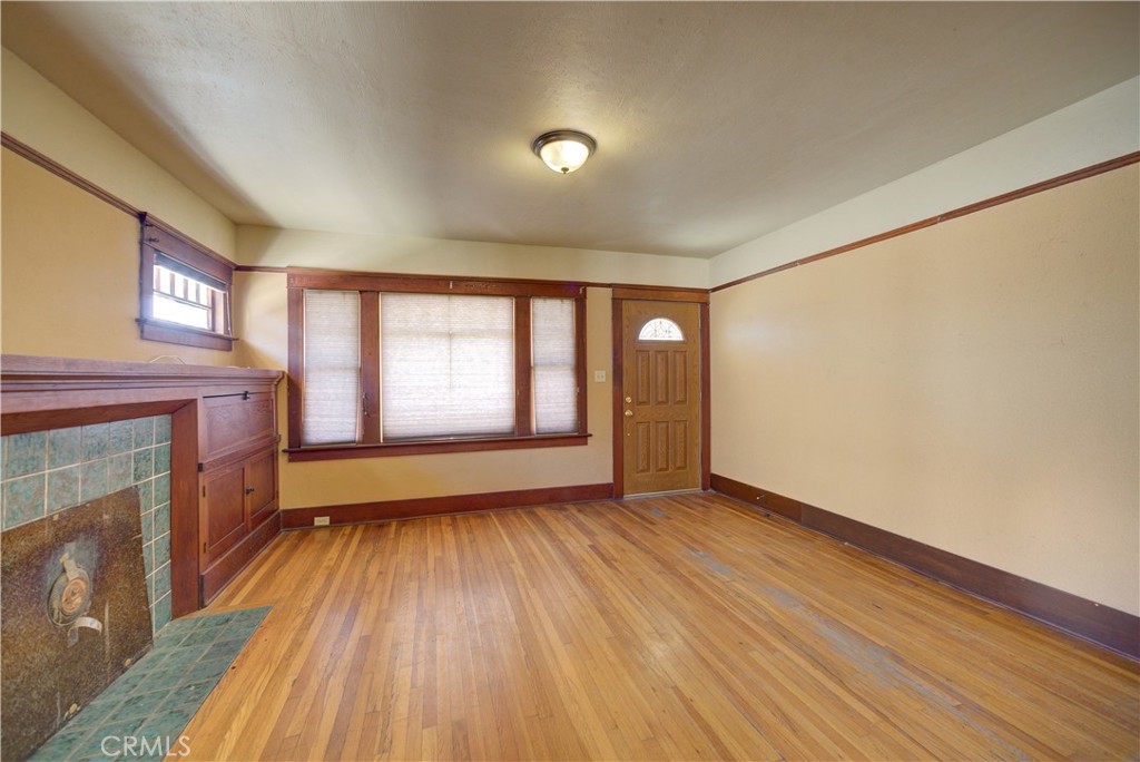 4579 11th Street Guadalupe, CA 93434 - Photo 6 of 40 an empty room with wooden floor and windows