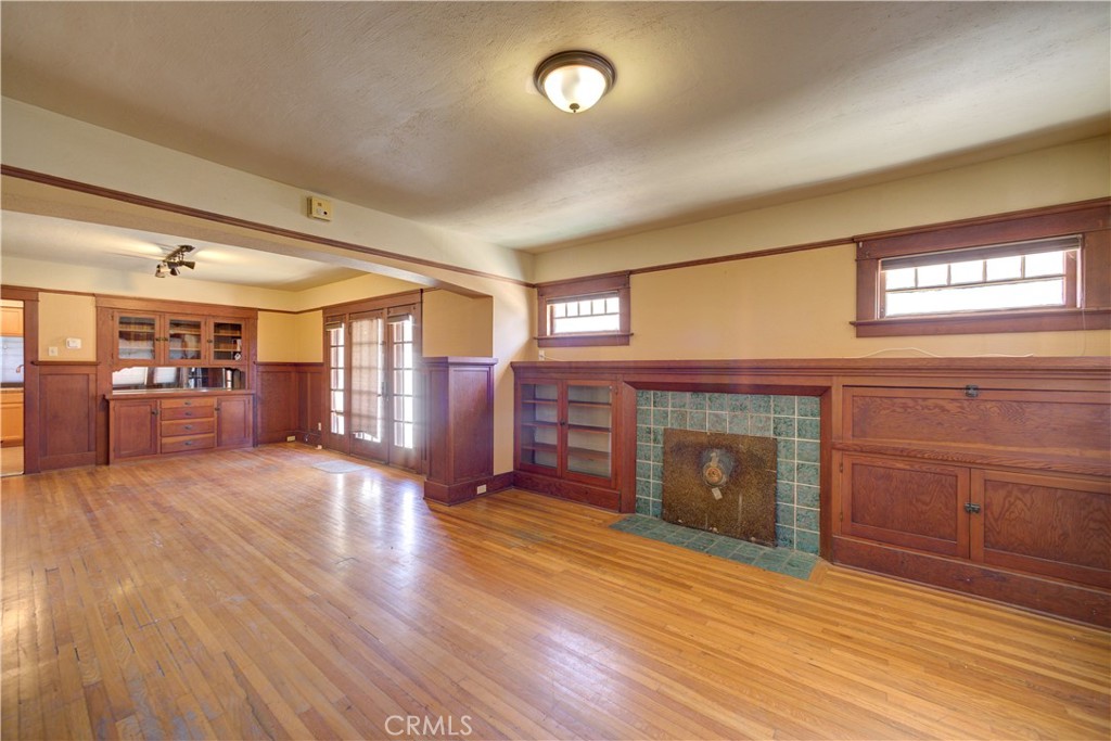 4579 11th Street Guadalupe, CA 93434 - Photo 7 of 40 an empty room with wooden floor and windows