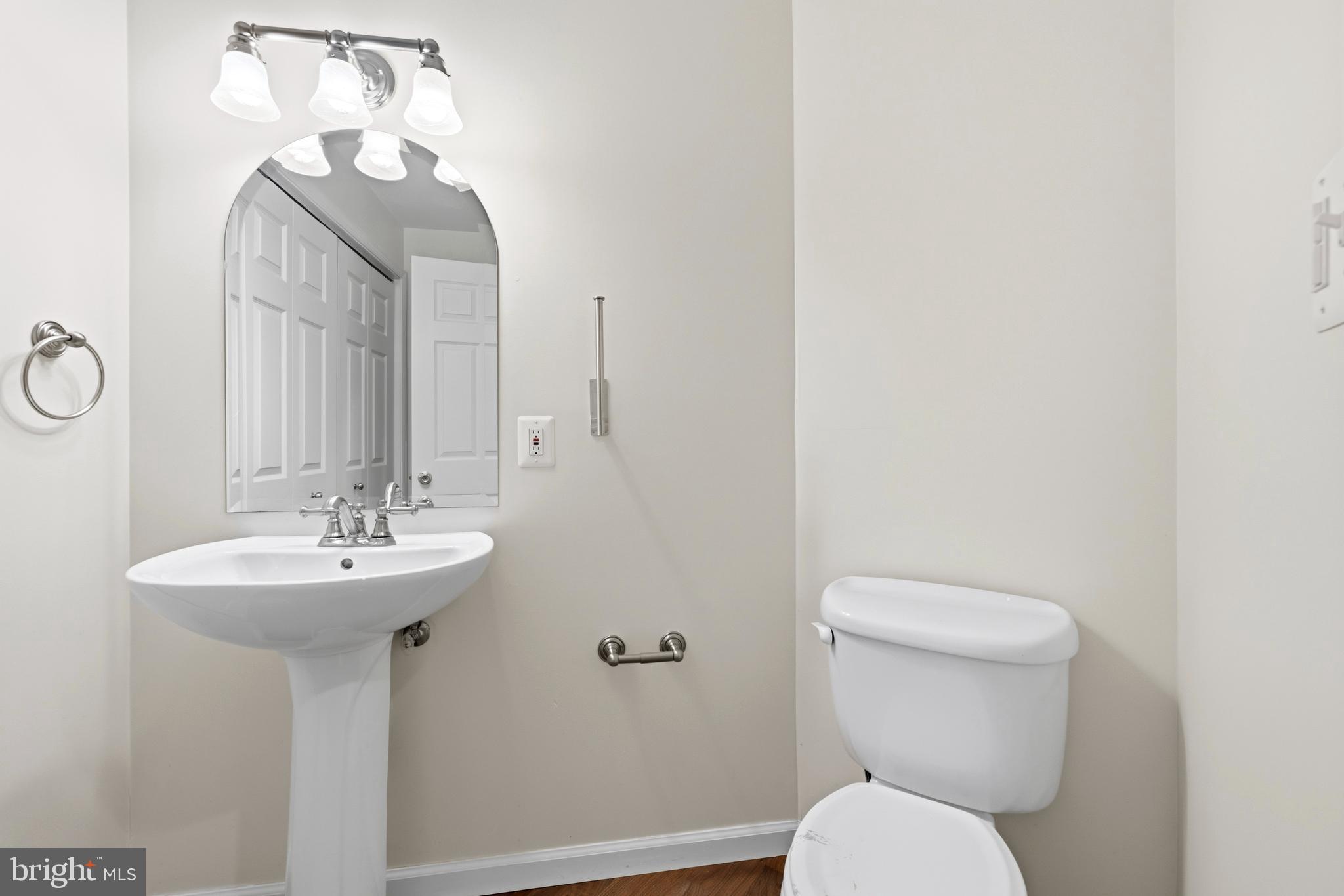 2030 Rosecrans Court Frederick, MD 21702 - Photo 28 of 33 a bathroom with a toilet a sink and mirror