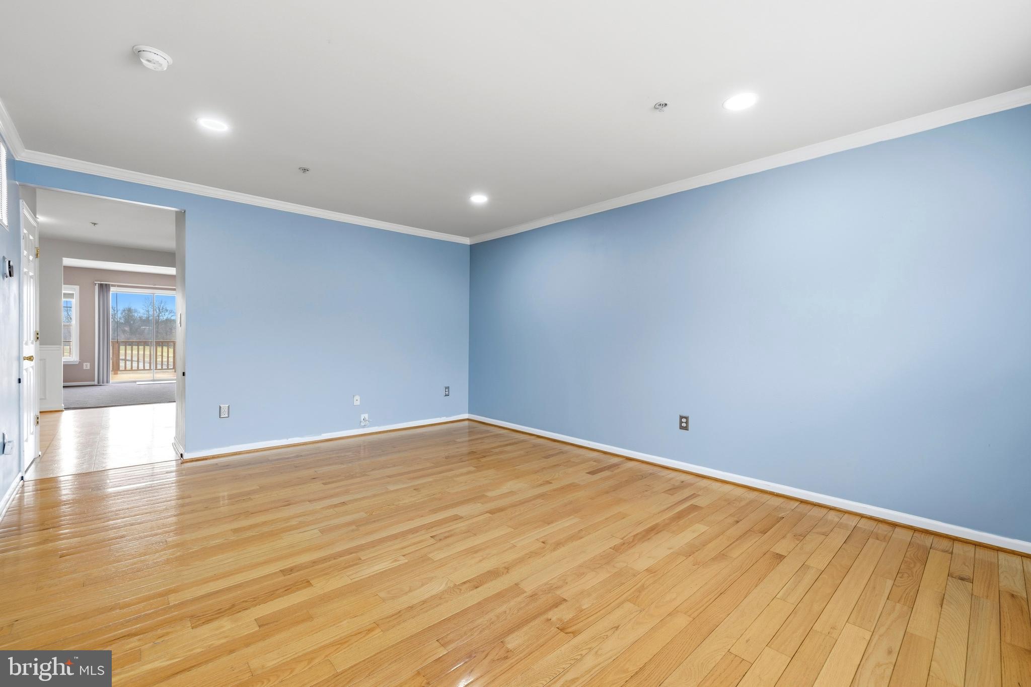 2030 Rosecrans Court Frederick, MD 21702 - Photo 3 of 33 an empty room with wooden floor and windows