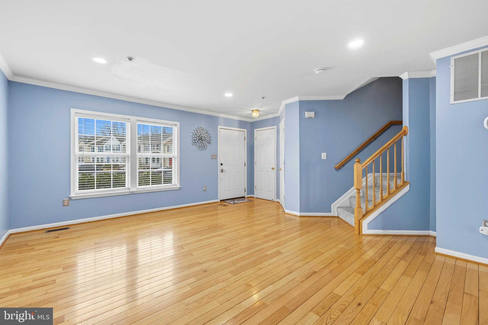 2030 Rosecrans Court Frederick, MD 21702 - Photo 4 of 33 a view of an empty room with wooden floor and a window