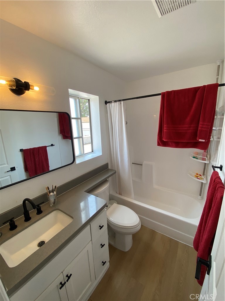 732 Eastshore Terrace, Unit 77 Chula Vista, CA 91913 - Photo 12 of 19 a bathroom with a sink mirror vanity and toilet