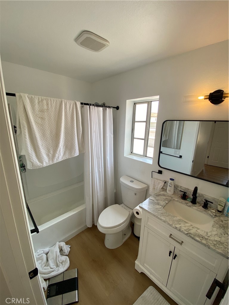 732 Eastshore Terrace, Unit 77 Chula Vista, CA 91913 - Photo 13 of 19 a bathroom with a granite countertop sink mirror vanity and toilet
