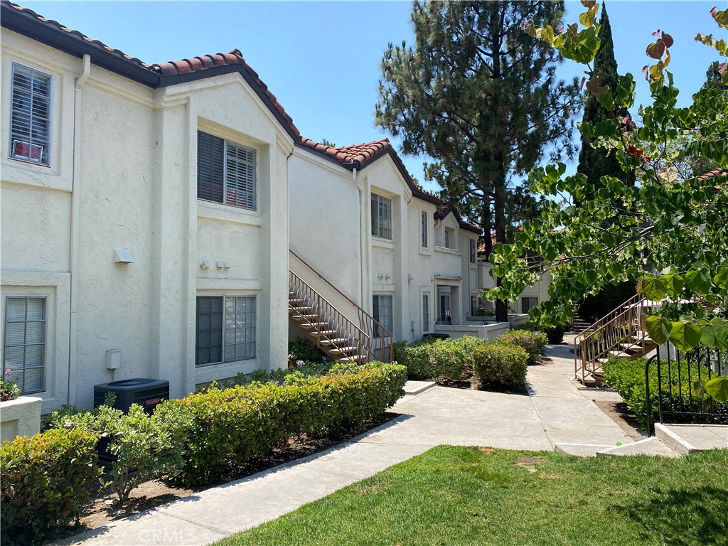 732 Eastshore Terrace, Unit 77 Chula Vista, CA 91913 - Photo 17 of 19 a view of a house with a yard and potted plants