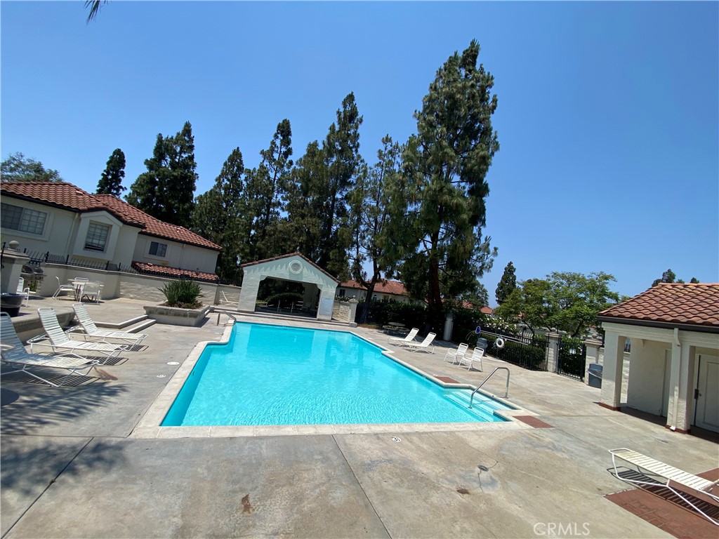732 Eastshore Terrace, Unit 77 Chula Vista, CA 91913 - Photo 2 of 19 a view of a house with swimming pool