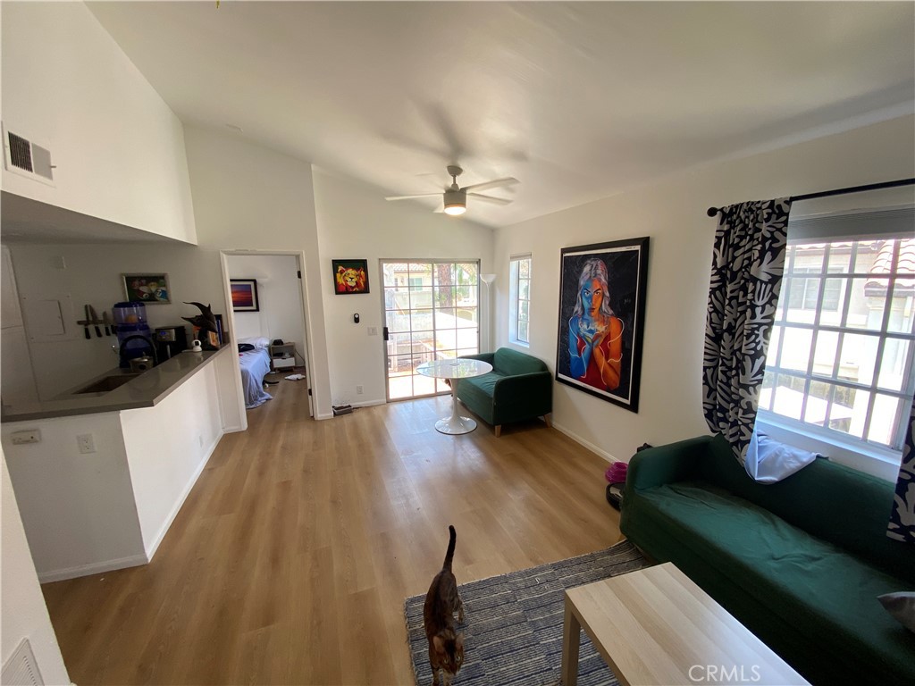 732 Eastshore Terrace, Unit 77 Chula Vista, CA 91913 - Photo 4 of 19 a living room with furniture and a wooden floor