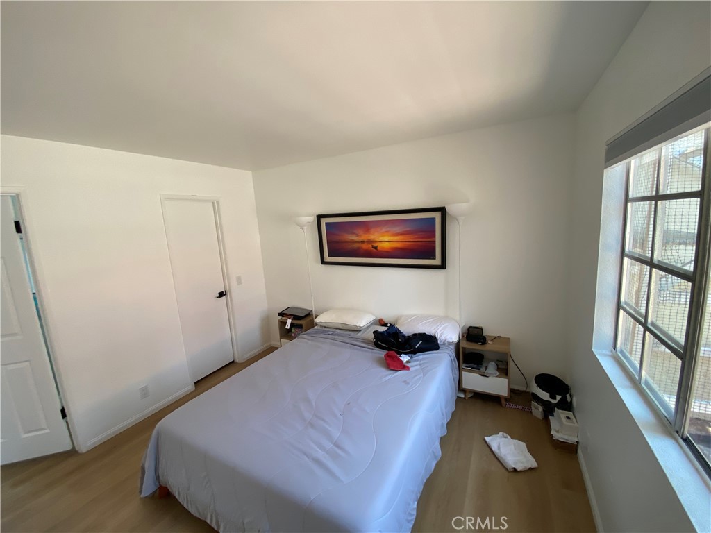 732 Eastshore Terrace, Unit 77 Chula Vista, CA 91913 - Photo 7 of 19 a bedroom with a bed and a window
