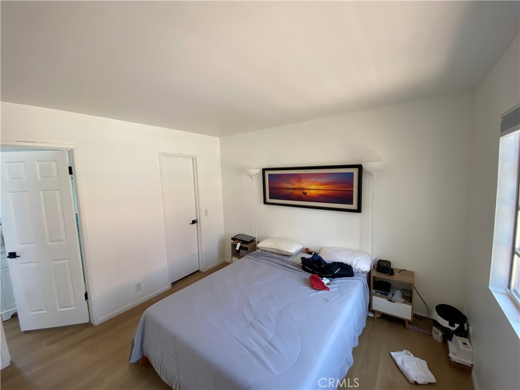 732 Eastshore Terrace, Unit 77 Chula Vista, CA 91913 - Photo 8 of 19 a bedroom with a bed and a window