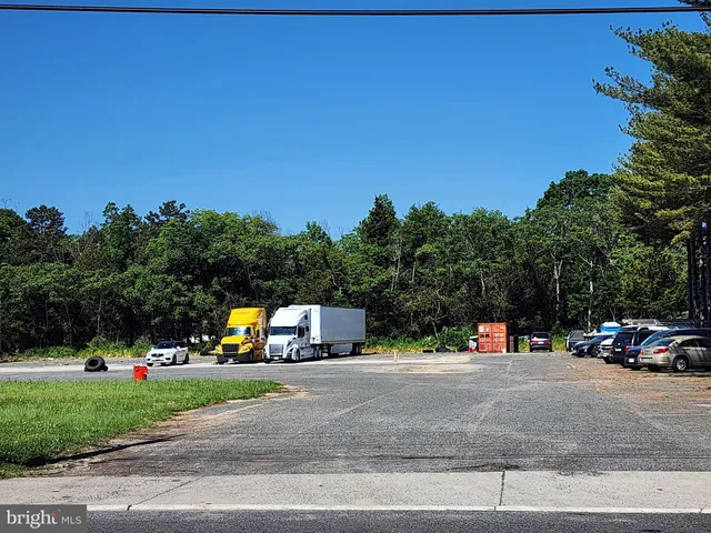 a view of street with parked cars