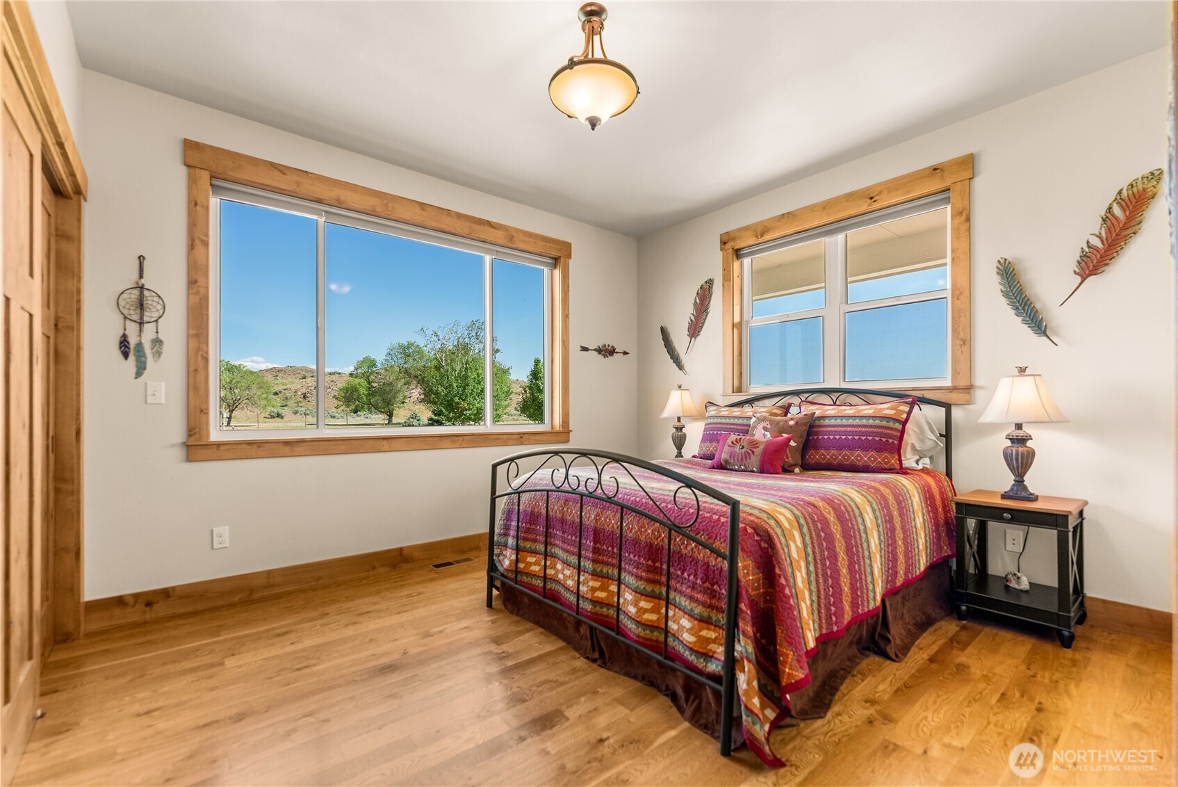 23 George Road Omak, WA 98841 - Photo 22 of 40 a bed sitting in a bedroom next to a window