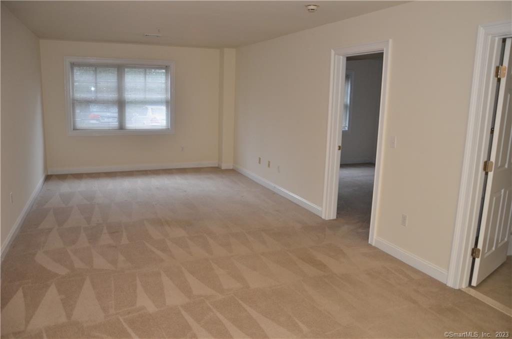 365 Westport Avenue, Unit 2B Norwalk, CT 06851 - Photo 12 of 19 an empty room with windows and closet