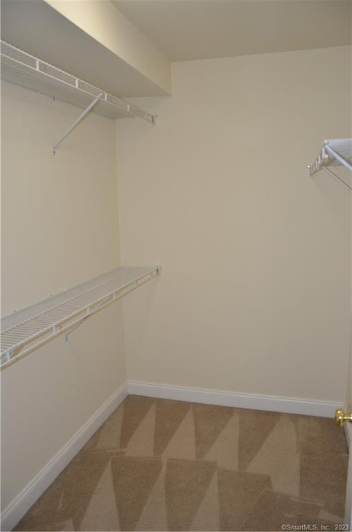 365 Westport Avenue, Unit 2B Norwalk, CT 06851 - Photo 18 of 19 a view of a room with racks on the wall