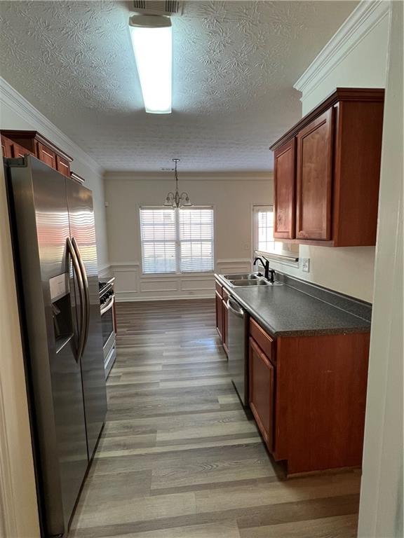 3815 Roses Trail Fairburn, GA 30213 - Photo 11 of 15 a kitchen with stainless steel appliances granite countertop a sink stove and refrigerator