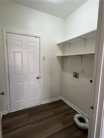 an empty room with wooden floor