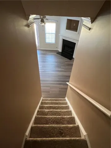 a view of entryway and hall with wooden floor