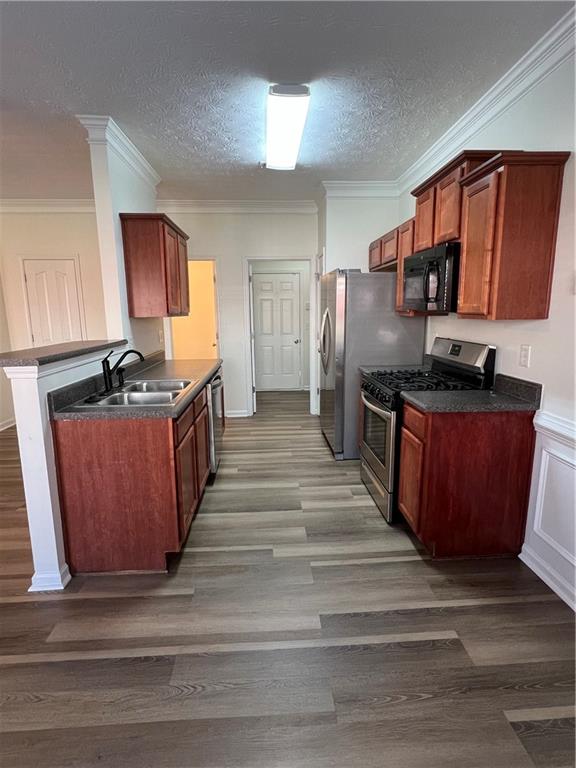 3815 Roses Trail Fairburn, GA 30213 - Photo 15 of 15 a kitchen with stainless steel appliances granite countertop a sink stove and refrigerator