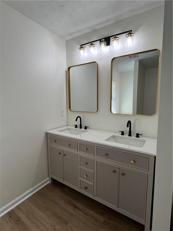 3815 Roses Trail Fairburn, GA 30213 - Photo 4 of 15 a spacious bathroom with a double vanity sink and mirror