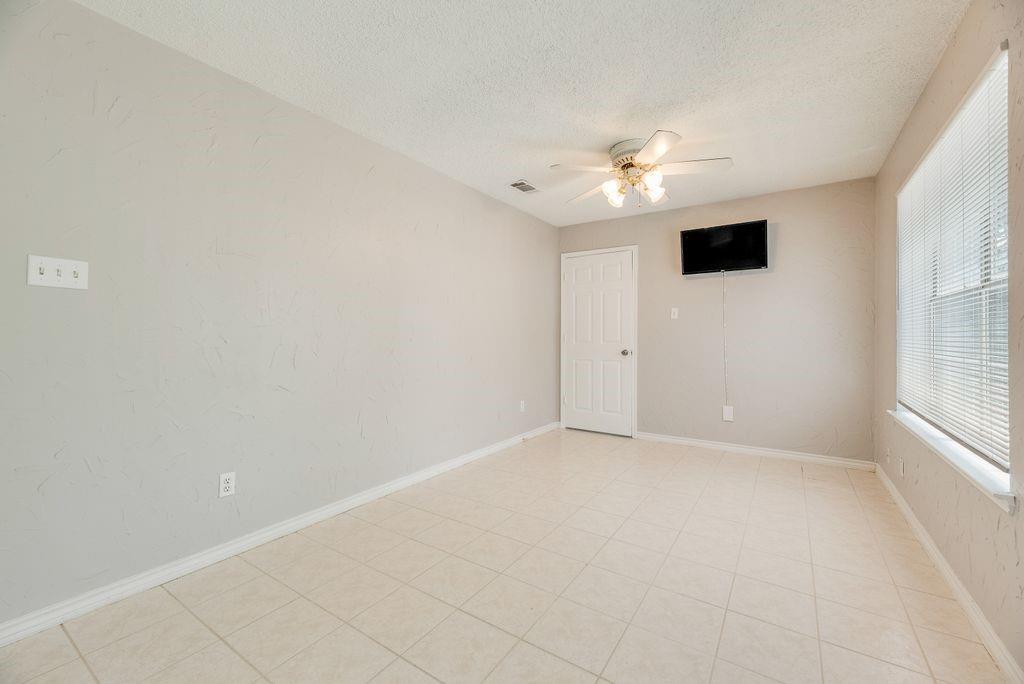 5610 Eagle Rock Road Arlington, TX 76017 - Photo 10 of 33 Room featuring tile flooring and neutral wall tones