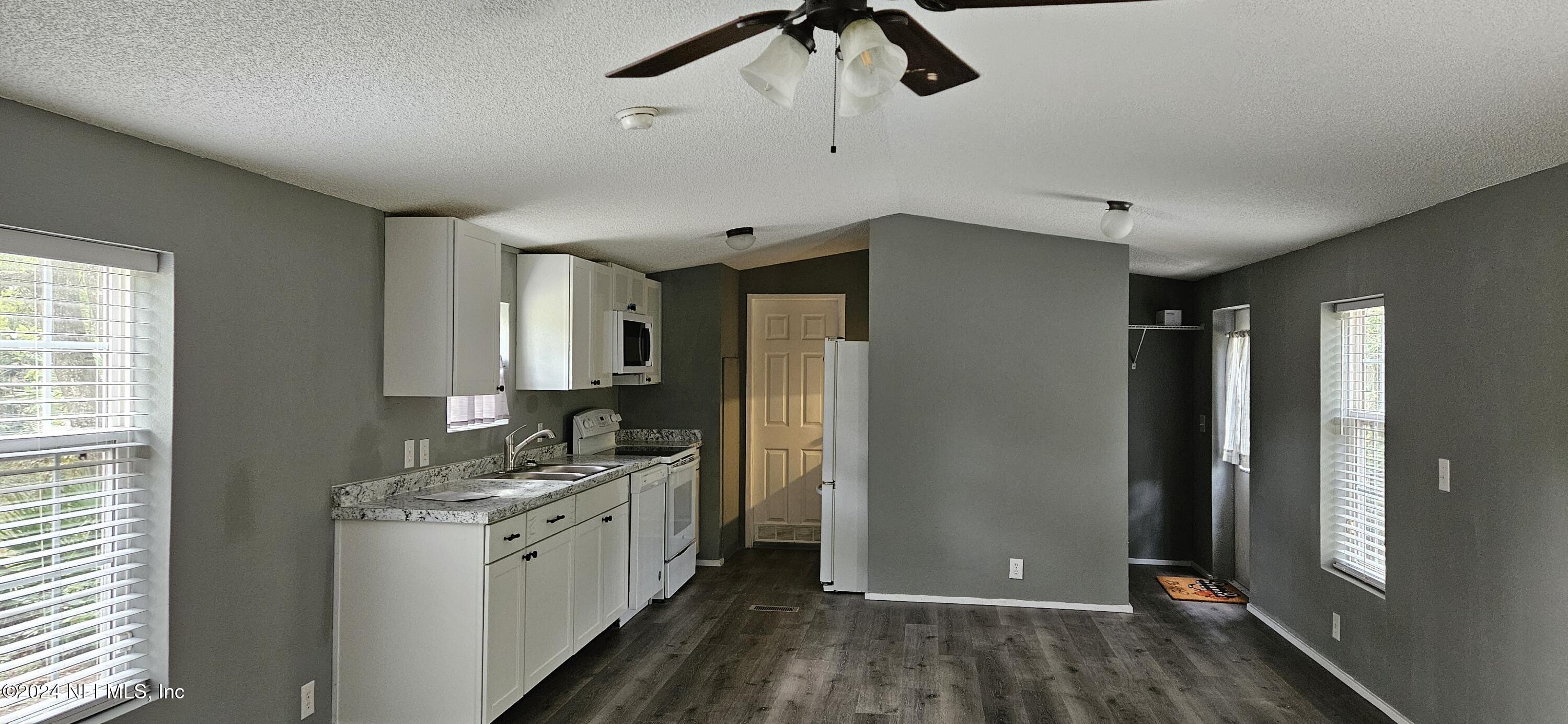 1570 Bluejay Drive Middleburg, FL 32068 - Photo 1 of 17 a kitchen with a refrigerator and a sink
