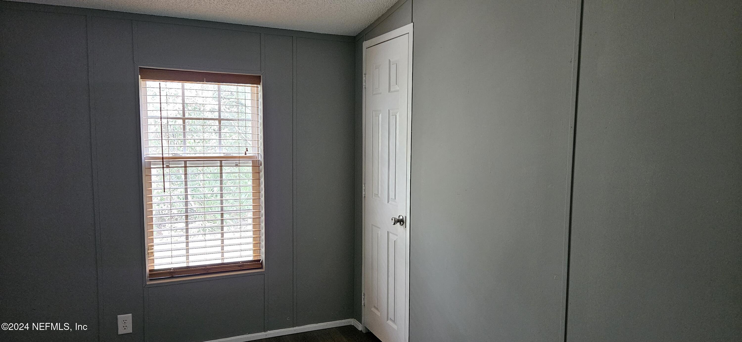 1570 Bluejay Drive Middleburg, FL 32068 - Photo 13 of 17 a view of an empty room with a window