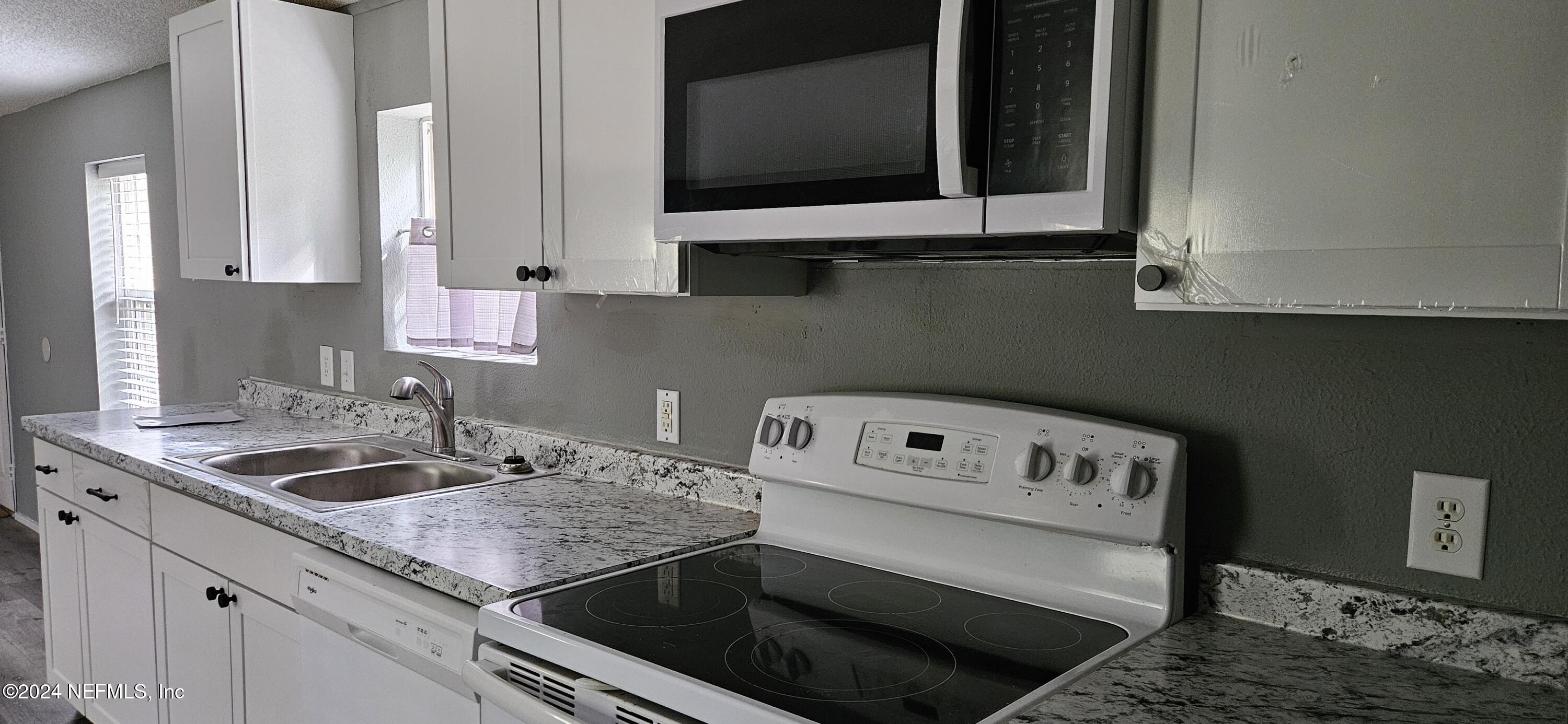 1570 Bluejay Drive Middleburg, FL 32068 - Photo 4 of 17 a kitchen with a sink and cabinets
