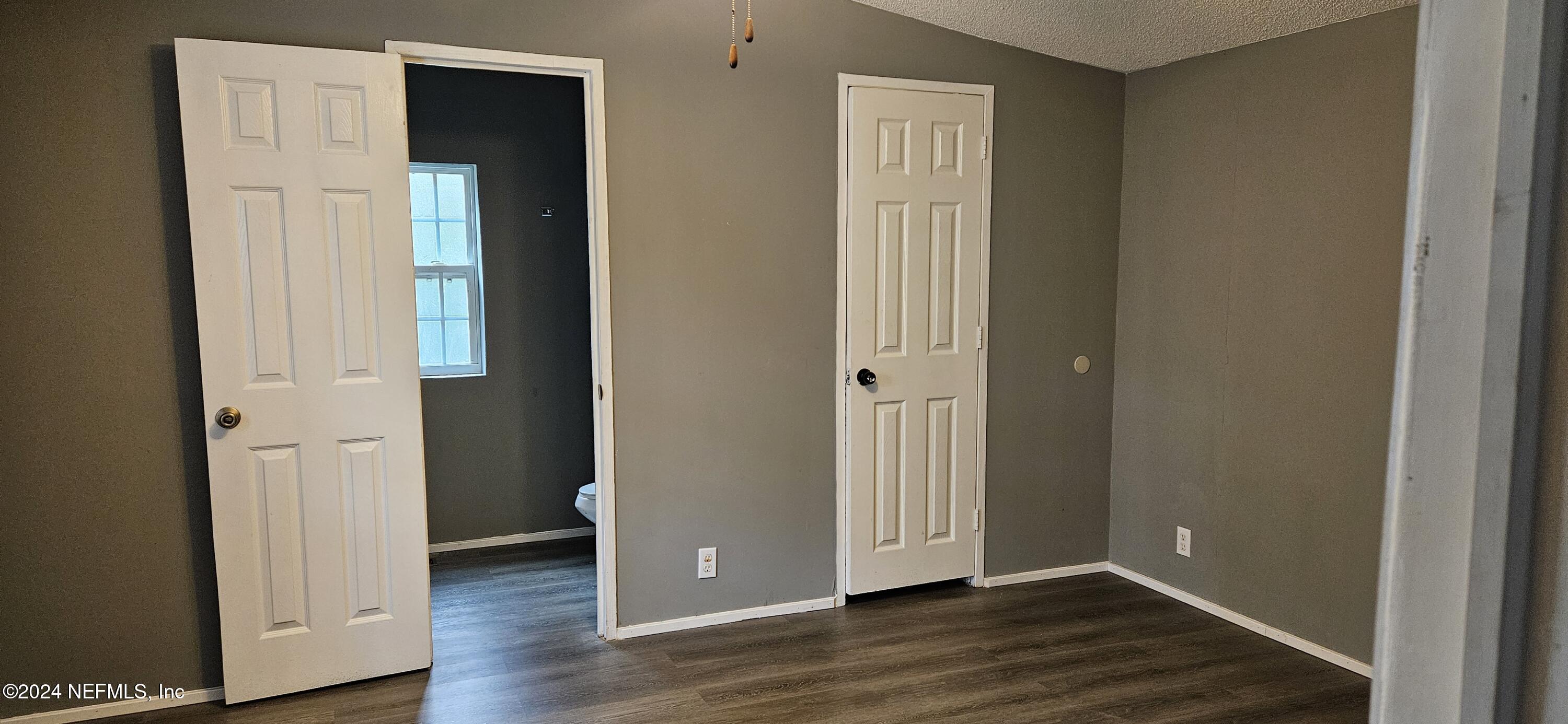 1570 Bluejay Drive Middleburg, FL 32068 - Photo 10 of 17 wooden floor with white walls