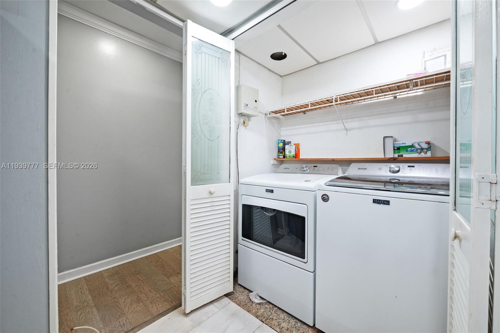 8001 Northwest 68th Terrace Tamarac, FL 33321 - Photo 14 of 27 a utility room with washer and dryer