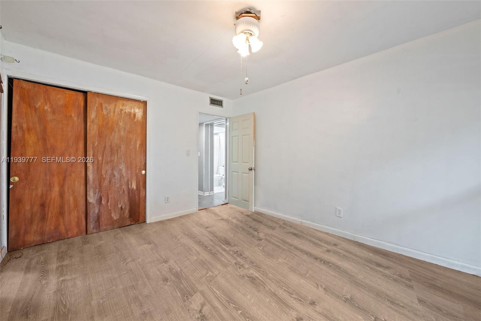 8001 Northwest 68th Terrace Tamarac, FL 33321 - Photo 19 of 27 a view of a livingroom with a chandelier fan