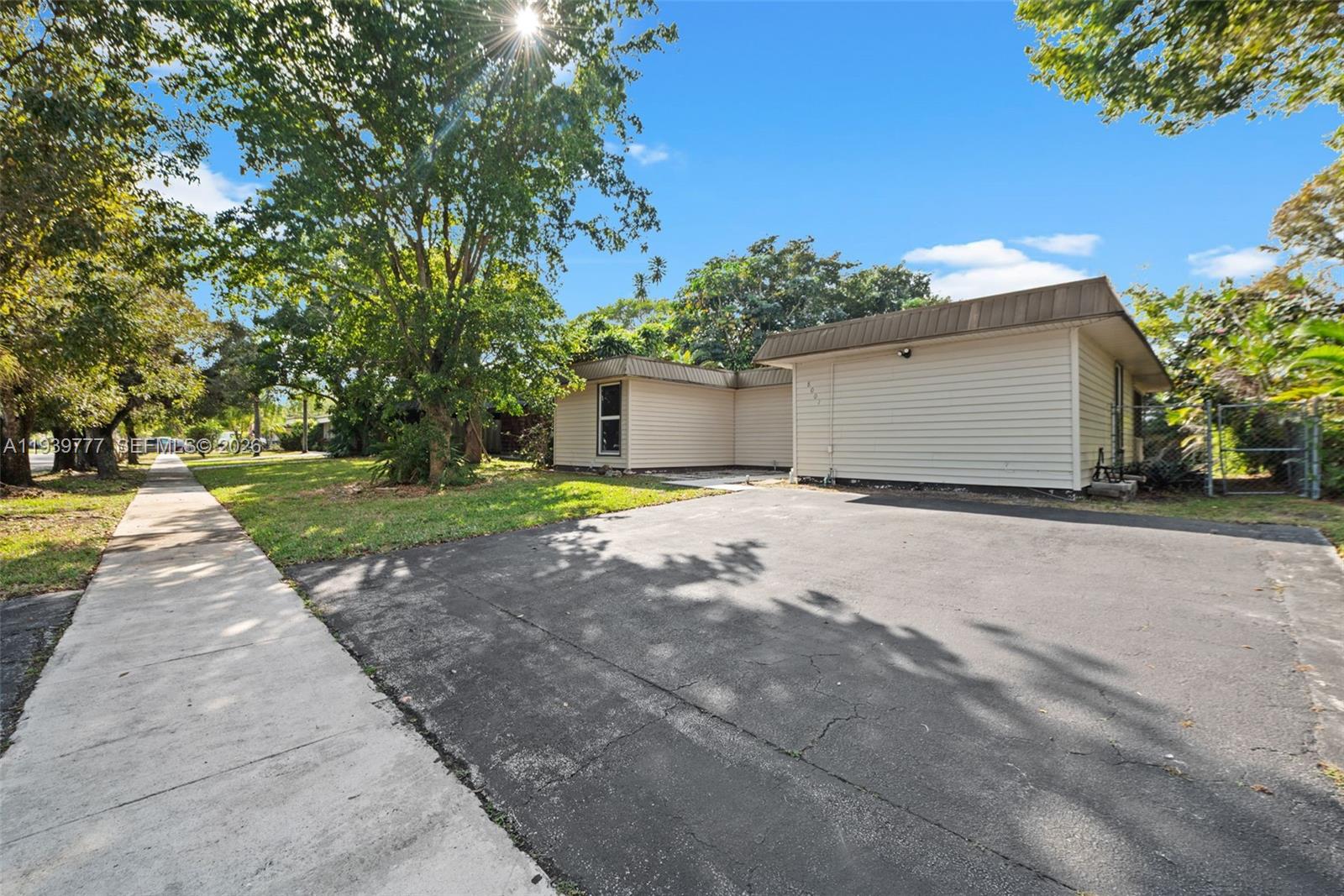 8001 Northwest 68th Terrace Tamarac, FL 33321 - Photo 2 of 27 a view of a yard with potted plants