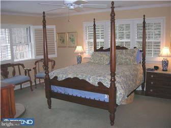 6 Rabbit Run Road Malvern, PA 19355 - Photo 11 of 12 a bed sitting in a bedroom next to a window