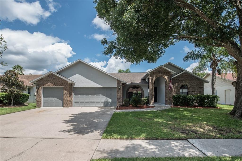 1414 Buckner Road Valrico, FL 33596 - Photo 1 of 1 Nice landscaping with 3 car garage, brick elevation