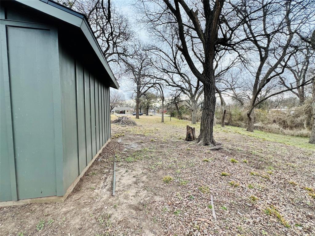 313 North Cage Street Hamilton, TX 76531 - Photo 8 of 8 a view of a yard covered in snow