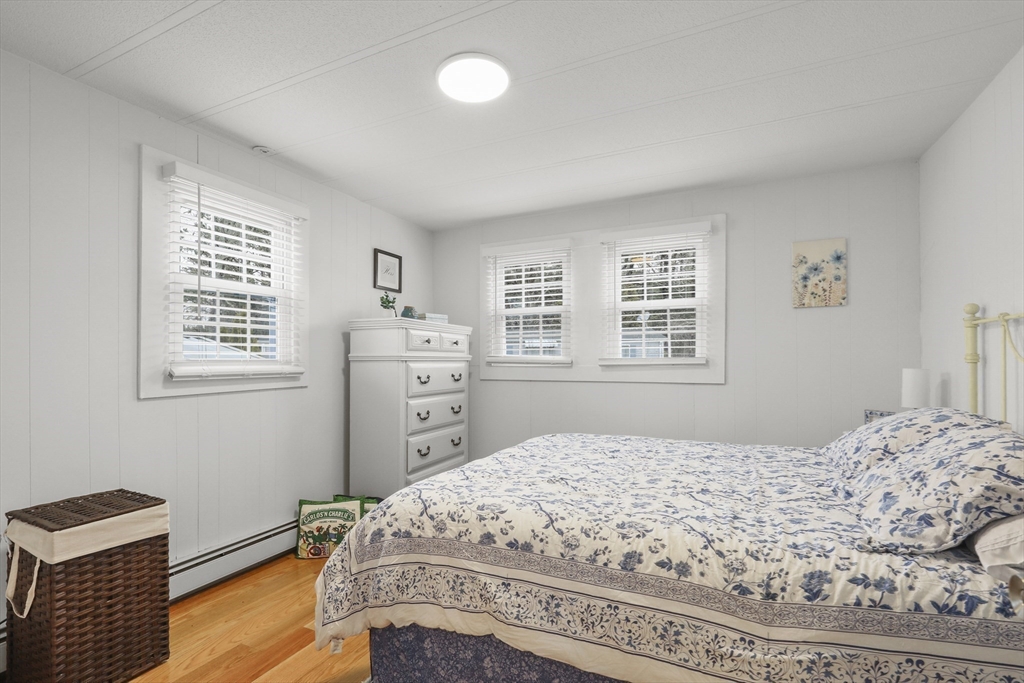 8 Madeline Street Wareham, MA 02538 - Photo 16 of 28 a bedroom with a bed and wooden floor