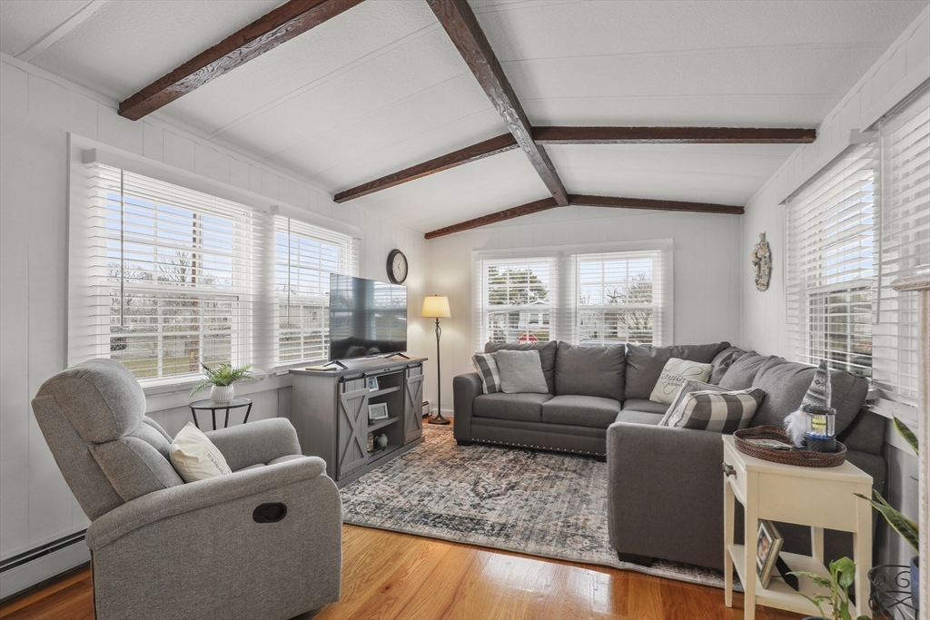 8 Madeline Street Wareham, MA 02538 - Photo 8 of 28 a living room with furniture and large windows