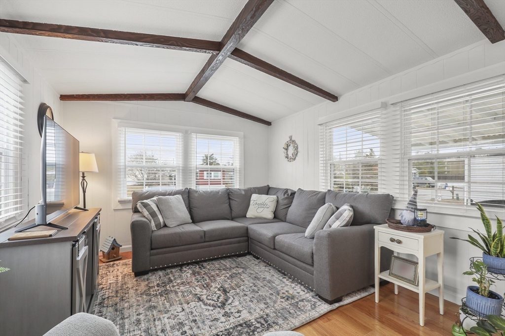 8 Madeline Street Wareham, MA 02538 - Photo 9 of 28 a living room with furniture and a large window