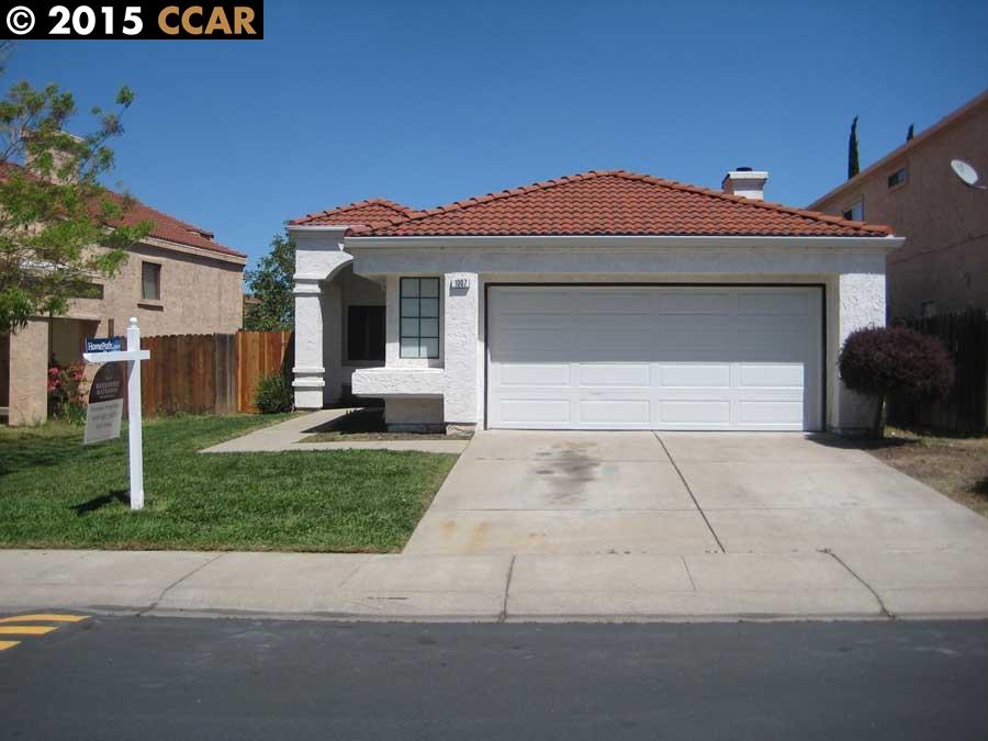 1007 Mepham Drive Pittsburg, CA 94565 - Photo 1 of 1 a front view of a house with a yard and garage