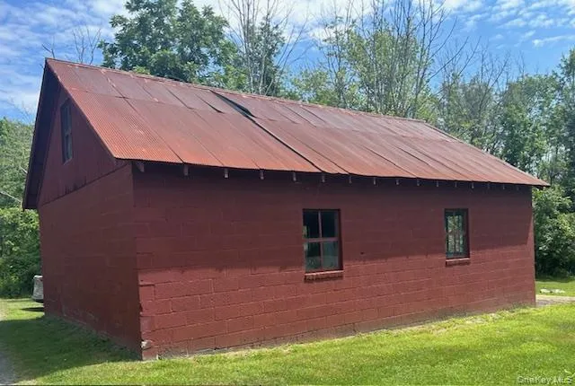 a aerial view of a house with a yard