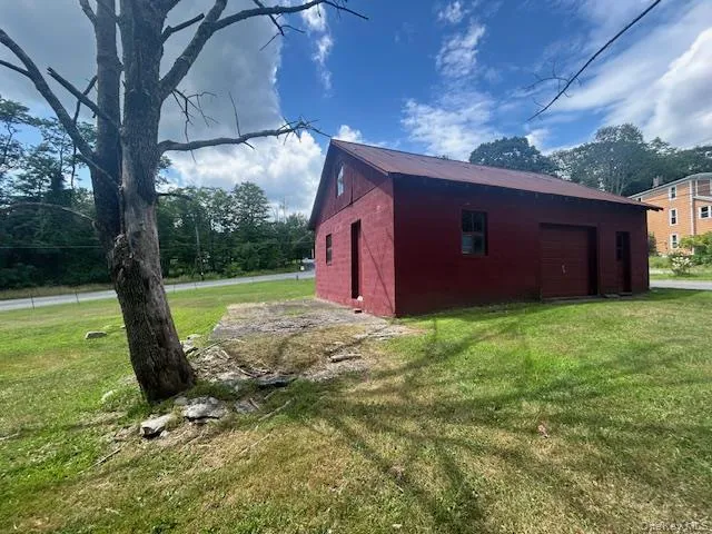 a view of a backyard of the house