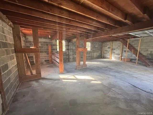 a view of a room with wooden walls