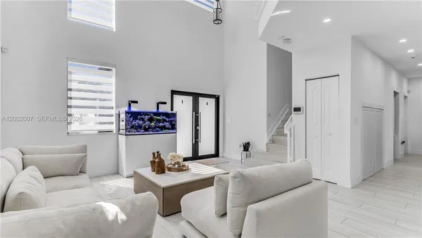 a living room with furniture and a window