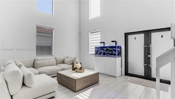 a room with furniture and white walls