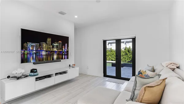 a living room with furniture and a couch