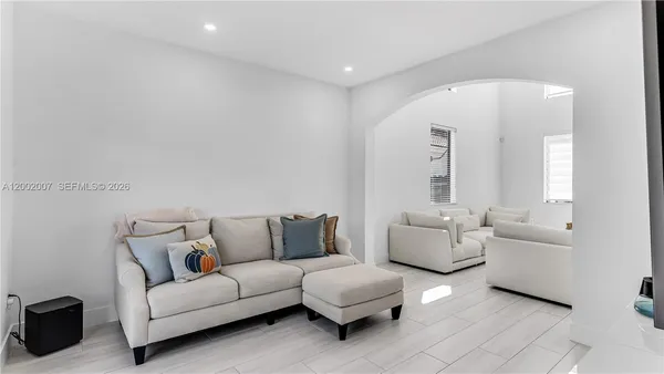 a kitchen with stainless steel appliances furniture a refrigerator and a stove top oven