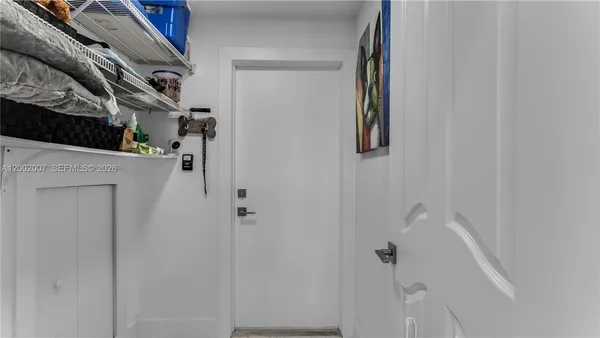 a view of living room with washer and dryer