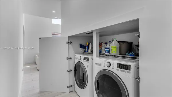 a white toilet sitting next to a bathroom sink