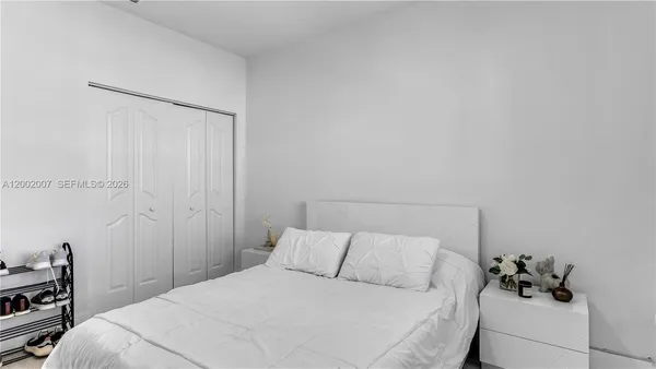 a room with a dresser and a window