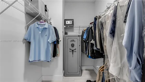 a view of empty room with window and stairs