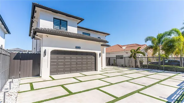 a front view of a house with a garage